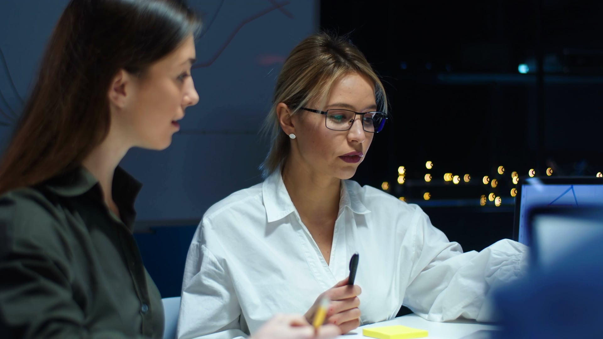 Two women looking at a screen